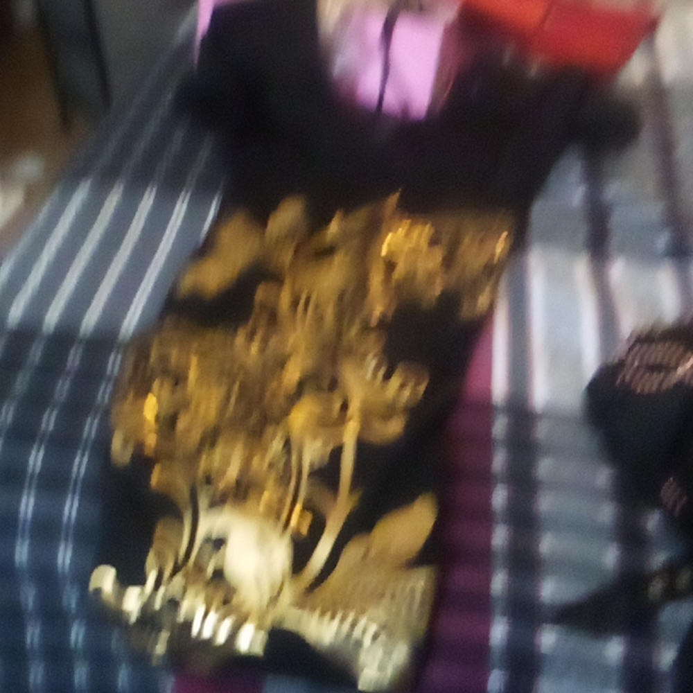 Two dresses one blouse one pair of sandals and one pair boots